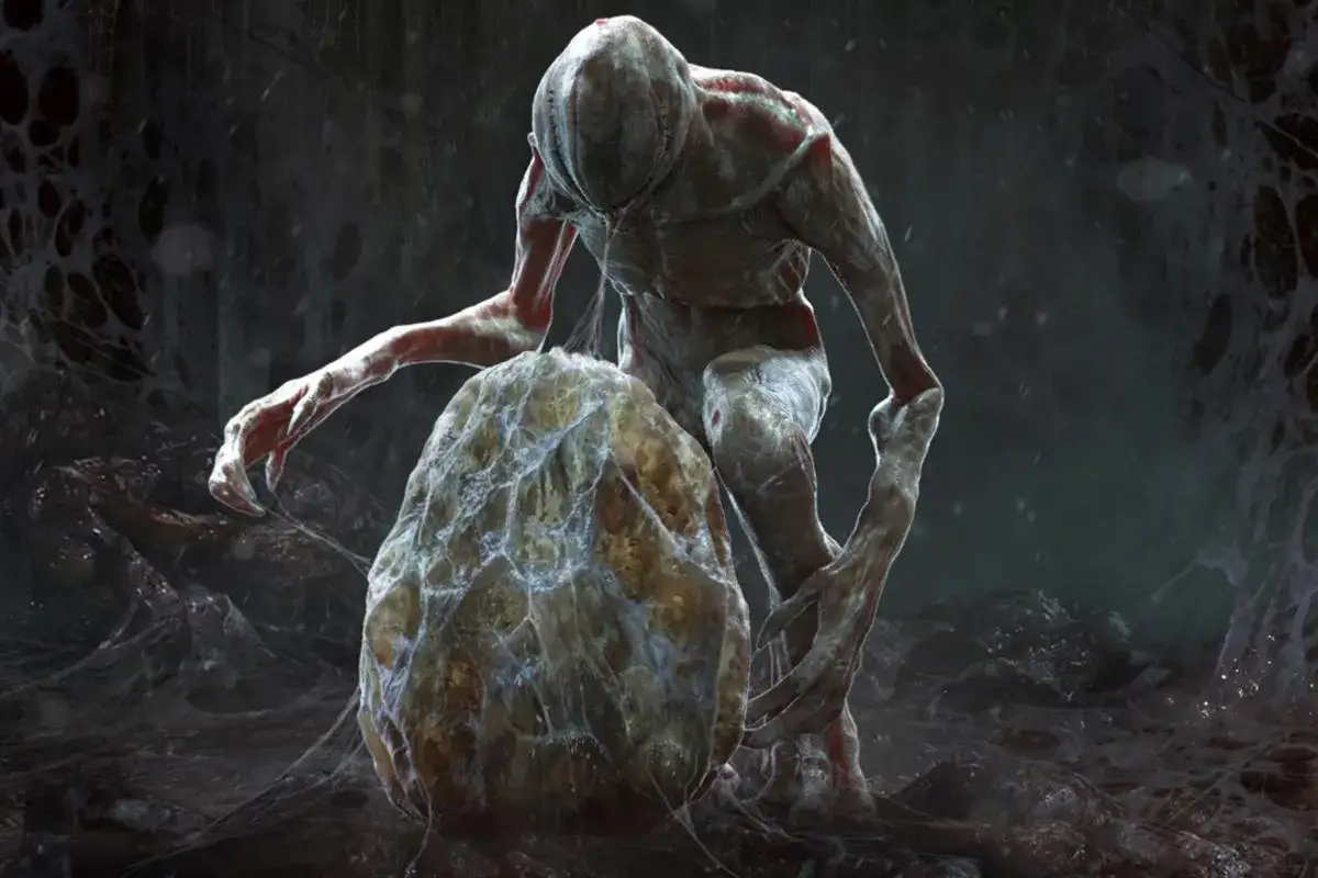 Demogorgon ze Stranger Things, z jego charakterystyczną paszczą, pochyla się nad jajem w mrocznym, pajęczynowym środowisku.